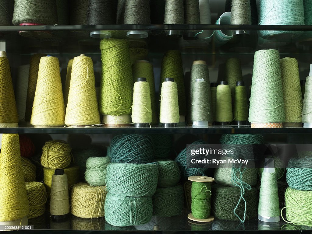 Spools of thread and balls of wool, close-up