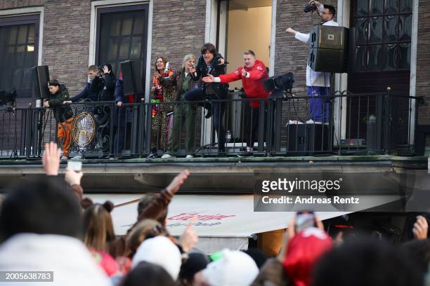 Singer Campino of the German band Die Toten Hosen performs from a balcony during the annual Rose Monday Carnival parade on February 12, 2024 in...