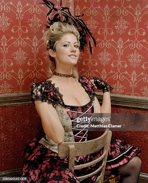 showgirl sitting on chair, smiling - hair color saloon stock pictures, royalty-free photos & images