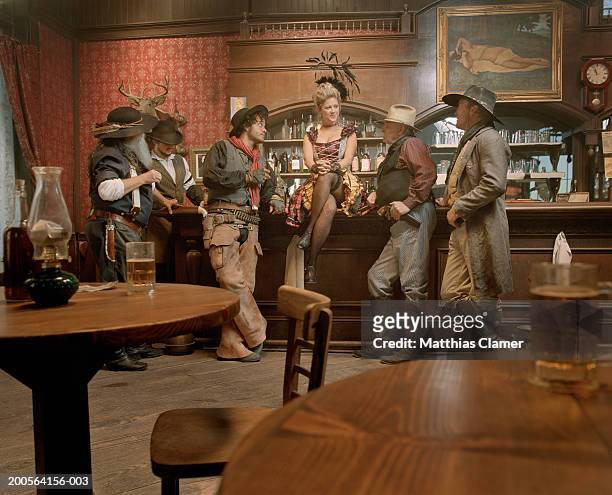 cowboys flirting with showgirl in saloon - saloon bildbanksfoton och bilder