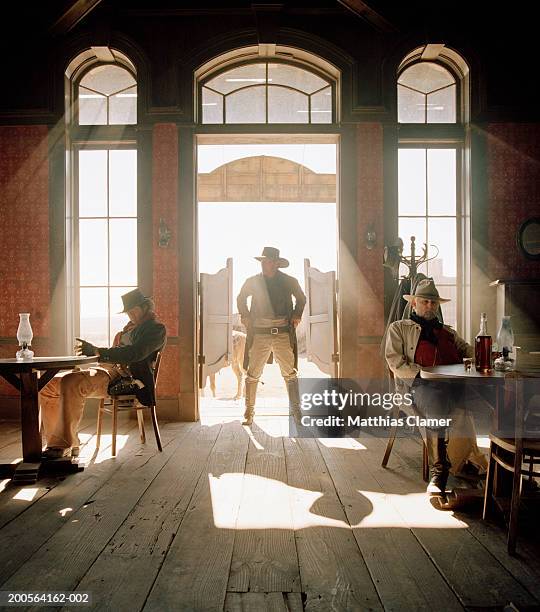 cowboys at saloon - cow boy - fotografias e filmes do acervo