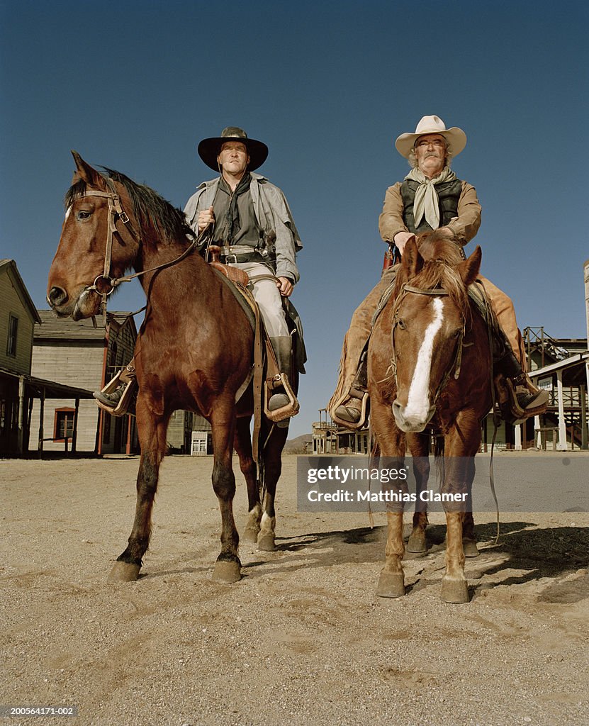 Cowboys riding on horses