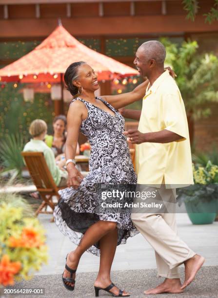 couple dancing in restaurant, side view - old couple dancing stock pictures, royalty-free photos & images