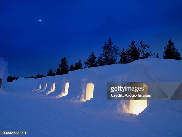 finland, lapland, kakslauttanen, illuminated igloo - iglu fotografías e imágenes de stock