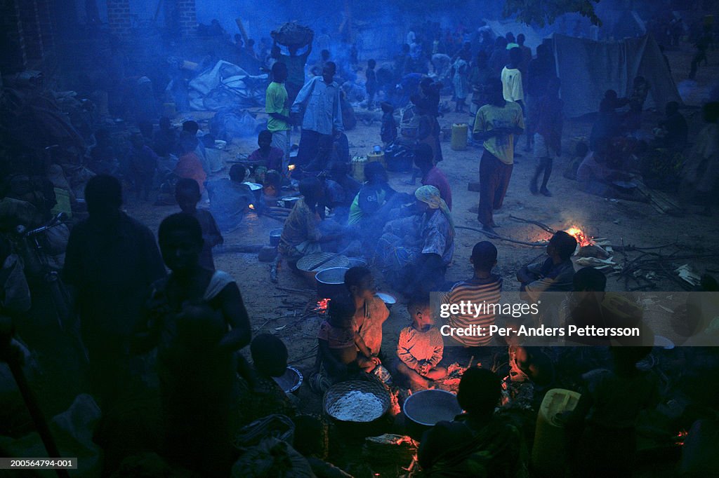 Congo,Katanga Province,Dubie,people in refugee camp by bonfires