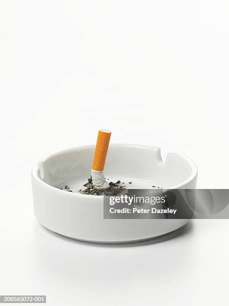 cigarette stub in ashtray - aschenbecher stock-fotos und bilder