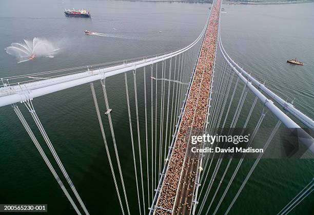 new york city marathon runners crossing verrazano bridge, aerial view - new york city marathon stock pictures, royalty-free photos & images