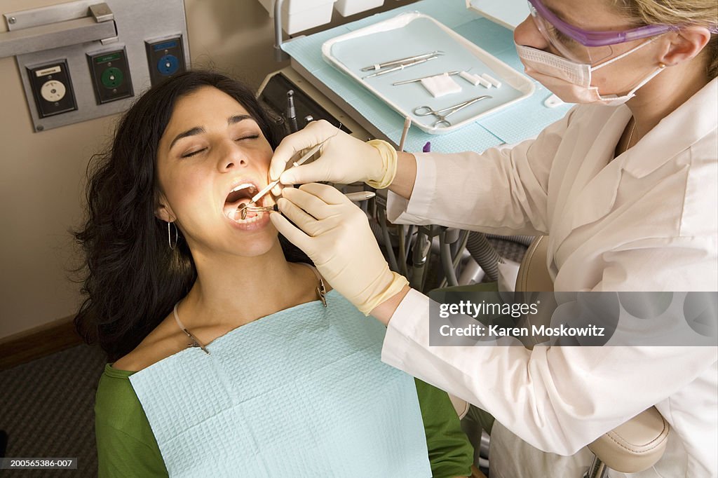 Dentist examining patient teeth, elevated view
