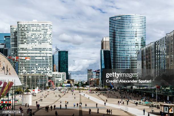 la defense business district with modern glass skyscrapers, paris, france - la defense stock pictures, royalty-free photos & images