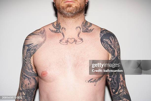 bearded man with tattooed arms and neck, against white background - chest stock pictures, royalty-free photos & images