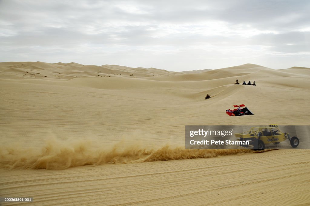 Buggy cars racing in desert