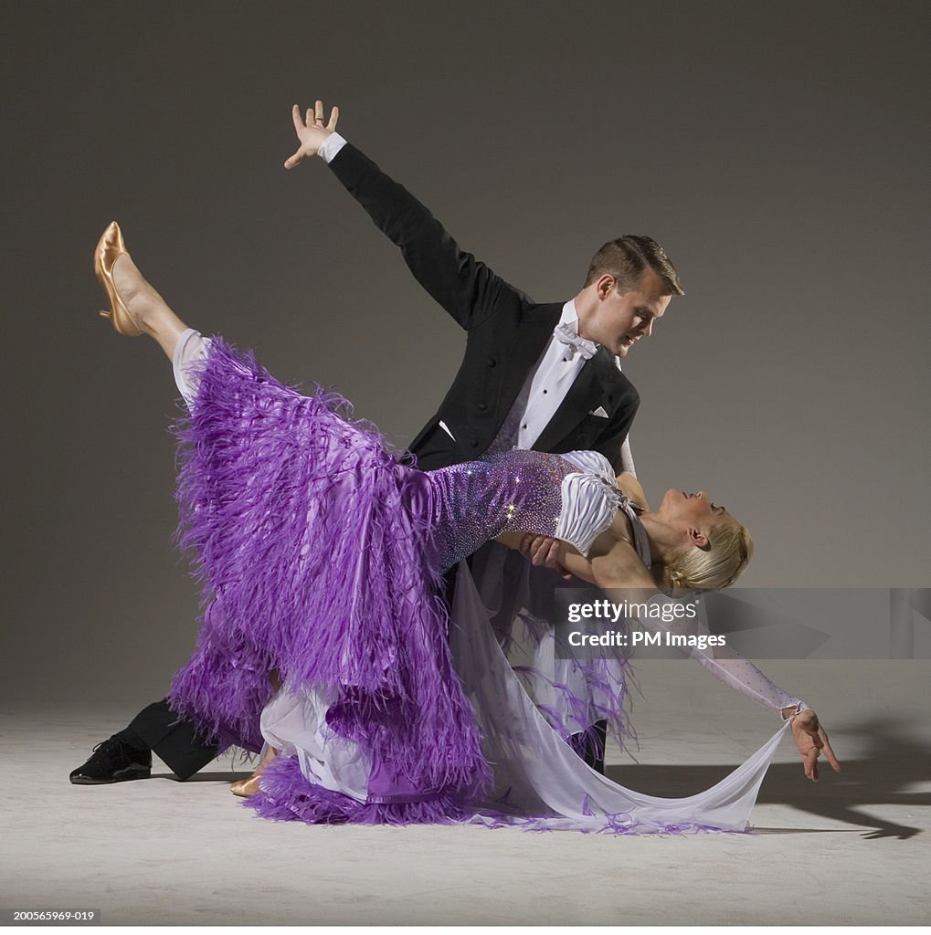 Ballroom dancing pair performing dip