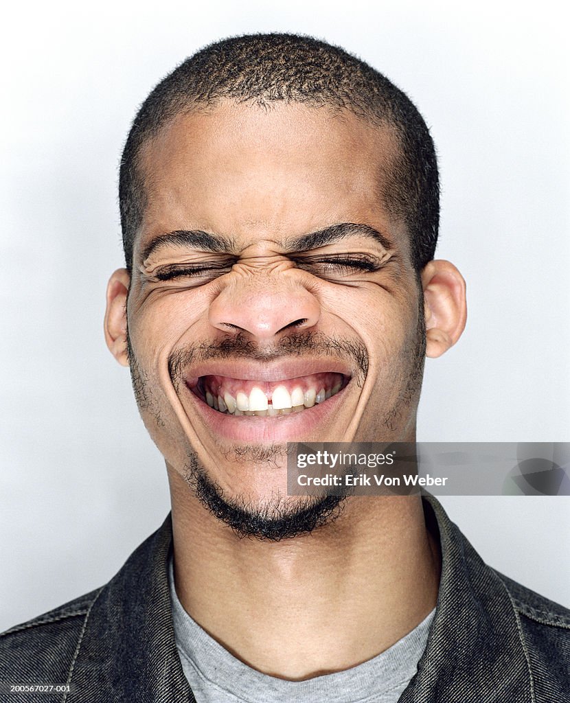 Young man pulling a funny face, close-up