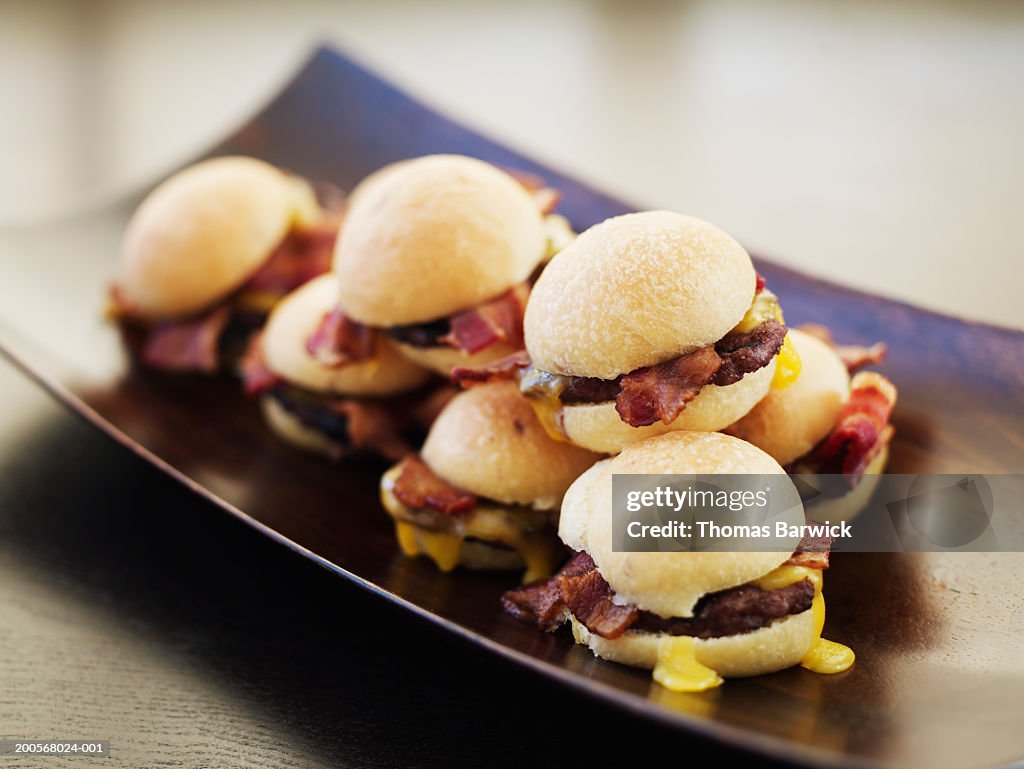 Mini bacon and cheddar burgers, close-up