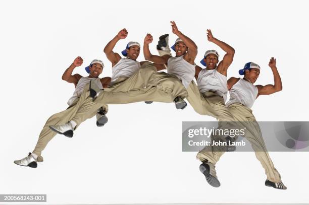 male breakdancer jumping in air (multiple exposure) - mehrfachbelichtung bewegung stock-fotos und bilder