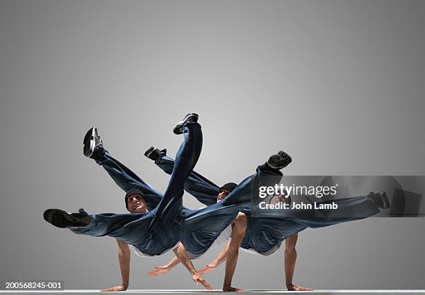 male breakdancer performing (multiple exposure) - break photos et images de collection