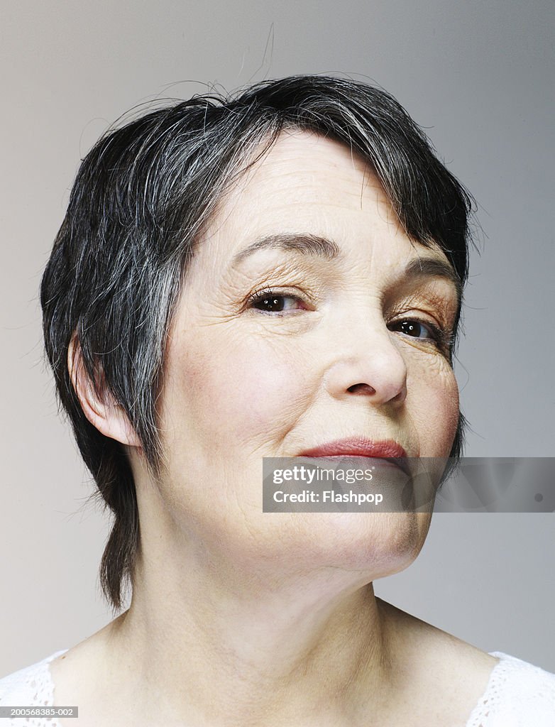 Senior woman smiling, portrait, close-up