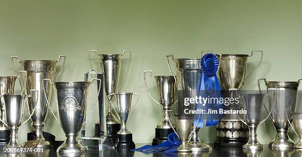 trophies in cabinet - trophy cabinet stock pictures, royalty-free photos & images