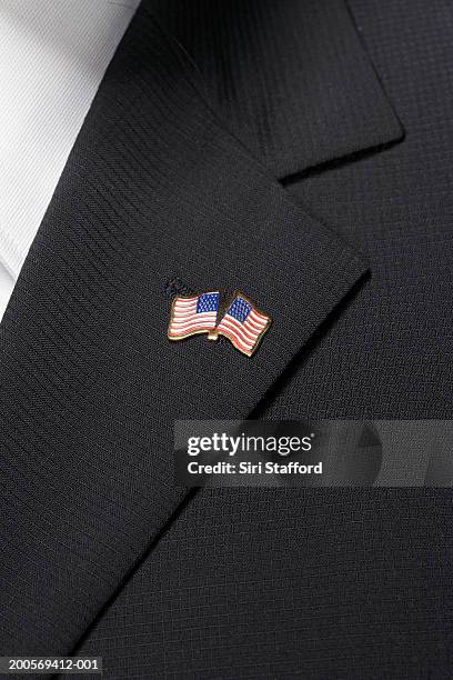 close up of american flag pin on lapel - bavero foto e immagini stock