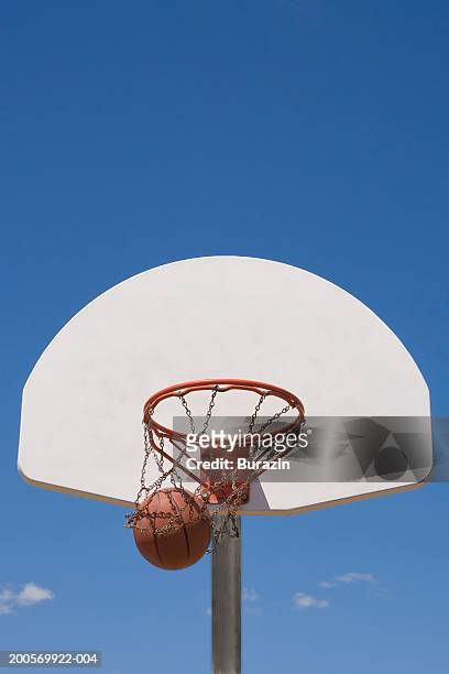 basketball falling through hoop - basketball hoop imagens e fotografias de stock
