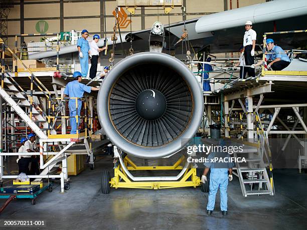 workers in aviation maintenance facility - jet engine stock pictures, royalty-free photos & images