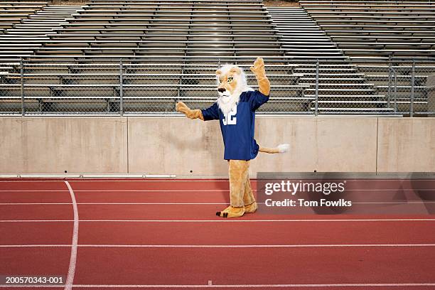 school mascot on running track - mascot foto e immagini stock