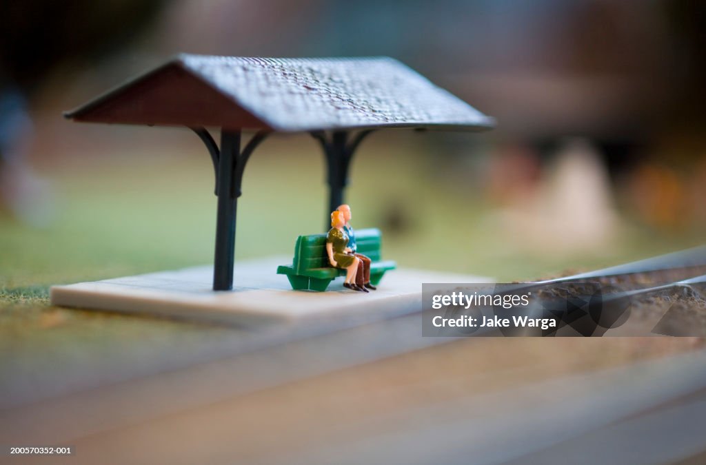 Figures on model railway platform