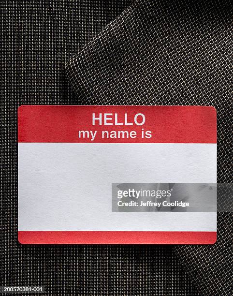 blank name badge on dress jacket  - identity stock-fotos und bilder