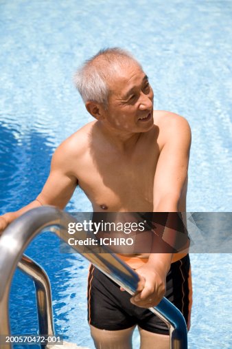 Man At Pool Steps Smiling Elevated View High-Res Stock Photo - Getty Images