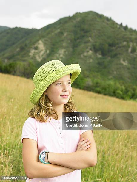 girl (10-11) standing in grassy field, waist up - east elk creek stock pictures, royalty-free photos & images