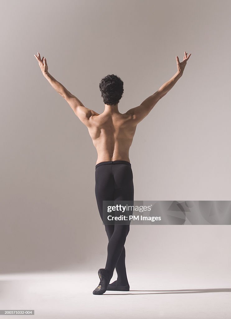 Man Practising Ballet Pose Rear View High-Res Stock Photo - Getty Images