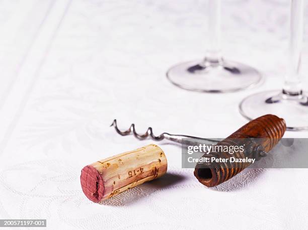 wine cork and corkscrew with glasses, close-up, studio shot - corkscrew foto e immagini stock