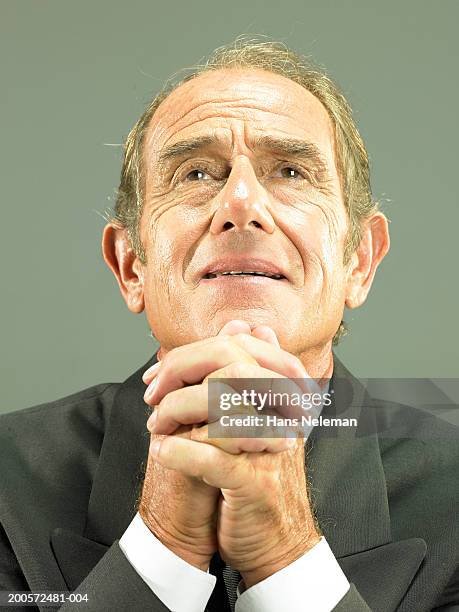 Senior Business Man With Hands Clasped Portrait, Stock-Foto
