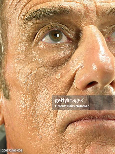 senior business man crying, close-up, portrait - teardrop stock-fotos und bilder