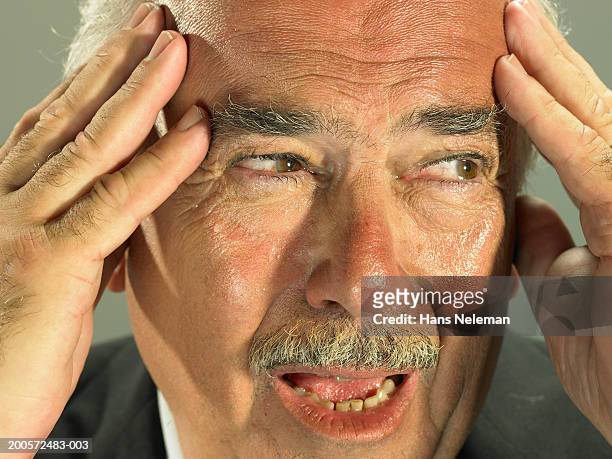 man with head in hands, close-up - defeat fear stock pictures, royalty-free photos & images