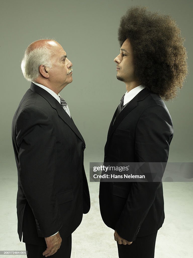 Two business men face to face, studio shot