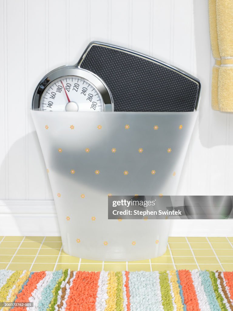 Weighing scales in plastic bin, close-up