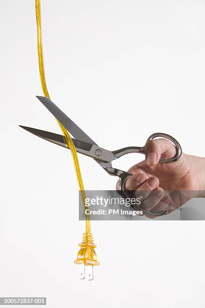 woman cutting cable, close-up - wire cut stockfoto's en -beelden