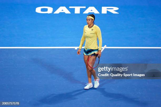 Caroline Garcia of France looks on against Naomi Osaka of Japan in their first round match during the Qatar TotalEnergies Open, part of the Hologic...