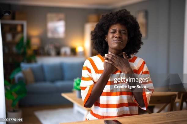 i wonder what could be causing me this much pain - throat stock pictures, royalty-free photos & images