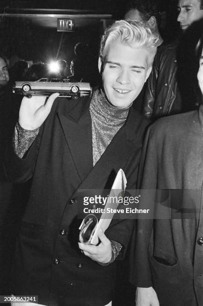 View of nightclub promotor and 'Club Kid' Lincoln Palsgrove IV as he holds a toy car at the Love Machine nightclub, New York, New York, April 11,...