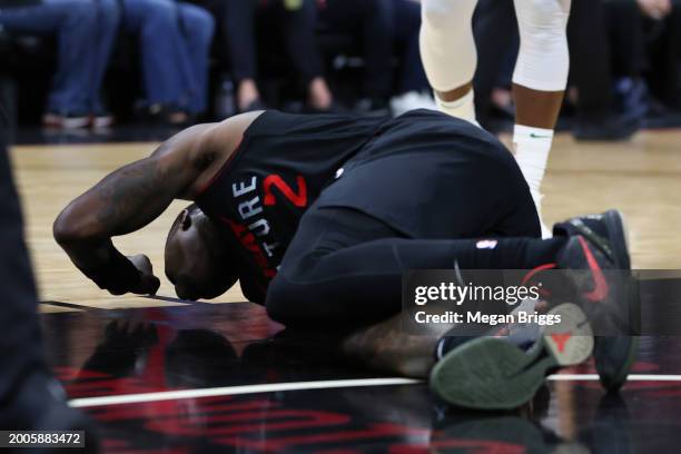 Terry Rozier of the Miami Heat reacts after suffering an apparent injury during the third quarter of the game against the Boston Celtics at Kaseya...