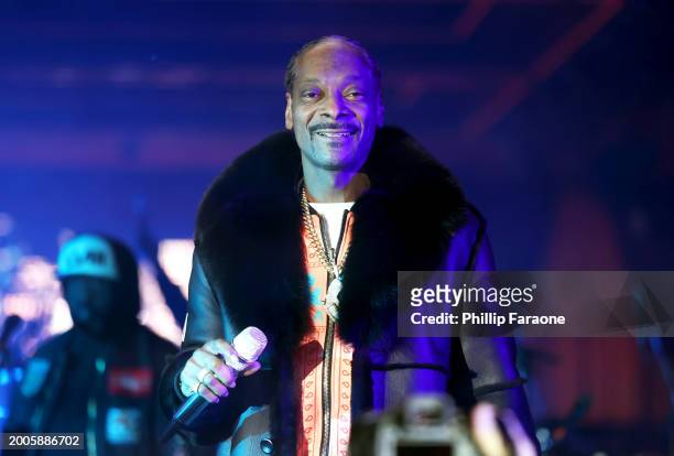 Snoop Dogg performs onstage during Flipper's Roller Boogie Palace big game after party celebrating the release of "Coming Home" by Usher and "Gin &...
