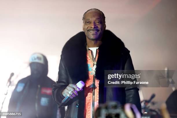 Snoop Dogg performs onstage during Flipper's Roller Boogie Palace big game after party celebrating the release of "Coming Home" by Usher and "Gin &...