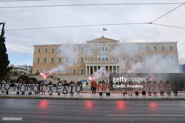 Students, holding banners, gather in front of the Greek parliament building to stage protest against the government's new university reform in...