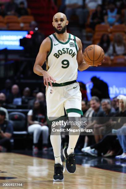 Derrick White of the Boston Celtics dribbles the ball against the Miami Heat during the first quarter of the game at Kaseya Center on February 11,...