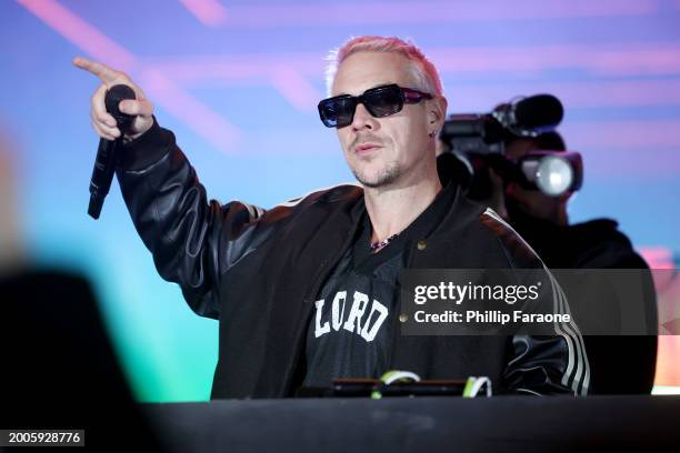 Diplo performs onstage during Flipper's Roller Boogie Palace big game after party celebrating the release of "Coming Home" by Usher and "Gin & Juice"...