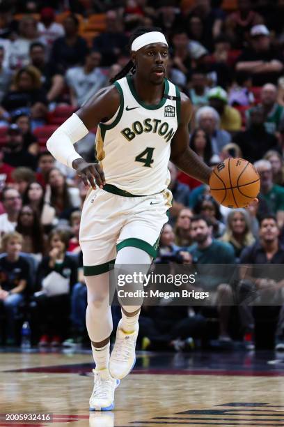 Jrue Holiday of the Boston Celtics dribbles the ball against the Miami Heat during the second quarter of the game at Kaseya Center on February 11,...