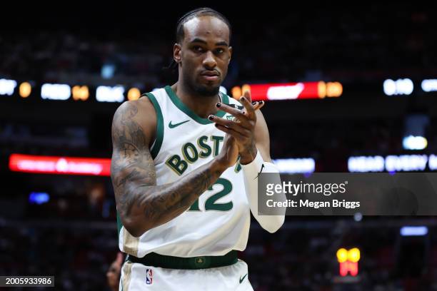 Oshae Brissett of the Boston Celtics reacts during the second quarter of the game against the Miami Heat at Kaseya Center on February 11, 2024 in...