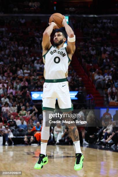 Jayson Tatum of the Boston Celtics shoots the ball against the Miami Heat during the second quarter of the game at Kaseya Center on February 11, 2024...